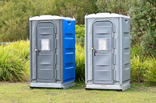 Portable toilets in a park Portable toilets in a park